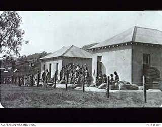 PORT MORESBY, NEW GUINEA. 1914-08. INSCRIPTION ON VERSO: "GROUP OF A.C. (ARMED CONSTABULARY?) AT RADIO STATION...AUG 1914, AWAITING INSTRUCTIONS FIRST DAY OF WAR, BEFORE STATION WAS ENTRENCHED". ..