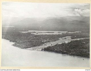 LAE, NEW GUINEA. 1944-09-19. THE BUSO RIVER MOUTH SITUATED APPROXIMATELY 20 MILES EAST OF LAE, VIEWED LOOKING TOWARDS THE NORTH EAST WITH THE FINISTERRE RANGE IN THE BACKGROUND. THE RIVER MOUTH, ..
