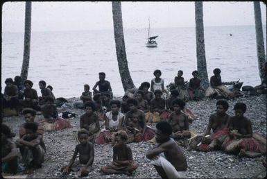 Lisu bringing us to join the spray team, at anchor off Igwageta : Fergusson Island, D'Entrecasteaux Islands, Papua New Guinea, 1959 / Terence and Margaret Spencer