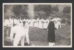 Reverend Eric Ure officiating a funeral, Metaria London Missionary Society church choir in the background, Papua New Guinea, c1945 to 1952