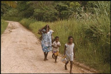 Pedestrians on the road to Yagaum (3) : Madang, Papua New Guinea, 1974 / Terence and Margaret Spencer