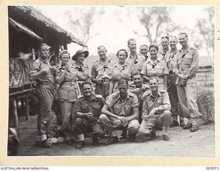 TOROKINA, BOUGAINVILLE. 1945-06-10. A GROUP OF AUSTRALIANS TAKEN AT THE NATIVE SING-SING AT THE WEBB ROAD COMPOUND ON THE NUMA NUMA TRAIL WHICH WAS ATTENDED BY A LARGE NUMBER OF TROOPS. THE NATIVES ..