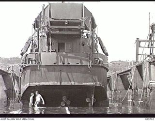 RABAUL, NEW BRITAIN, 1946-01-30. A PREFABRICATED FLOATING DOCK, 400 TONS, WAS ASSEMBLED BY 13 WATER TRANSPORT WORKSHOPS, CORPS OF AUSTRALIAN ELECTRICAL AND MECHANICAL ENGINEERS, AT RABAUL. PARTS ..
