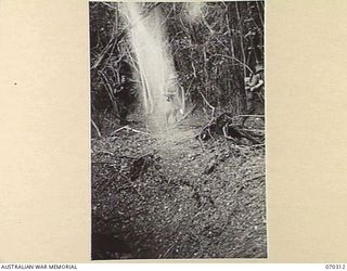 MALALAMAI - YAGOMAI, NEW GUINEA. 1944-02-09. MEMBERS OF AN ARTILLERY RECONNAISSANCE PARTY ATTACHED TO THE 30TH INFANTRY BATTALION FROM THE 2/14TH FIELD REGIMENT