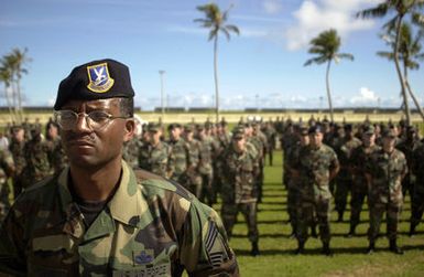 U.S. Air Force CHIEF MASTER SGT. Errol A. Sanders, 36 Security Forces Squadron, 36th Air Base, Wing, sheds a tear in front of a troop formation during a wreath laying ceremony, in memory and dedication of National POW/MIA Day at the Arch Light Memorial, Andersen Air Force Base, Guam, on Sept. 14, 2004.(U.S. Air Force PHOTO by STAFF SGT. Bennie J. Davis III) (RELEASED)