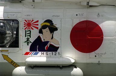 The colorful squadron art is displayed on the side of a Japanese Maritime Self Defense Force SH-60 helicopter during exercise RIMPAC '98