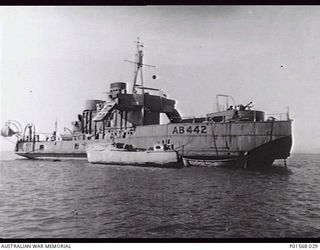 LAE, NEW GUINEA. 1944. AB422 FRANCES PEAT ANCHORED TO ONE ANCHOR; THE STARBOARD ANCHOR AND CHAIN HAD BEEN LOST. THE FRANCES PEAT WAS A FORMER HAWKESBURY RIVER (NSW) VEHICULAR FERRY REFITTED AS AN ..