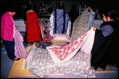 Women decorating chair for guest of honour at Niuean ear-piercing ceremony, Auckland