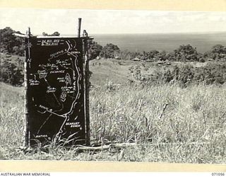 FINSCHHAFEN AREA, NEW GUINEA. 1944-03-13. ONE OF MANY BATTLE SIGNS IN THE FINSCHHAFEN AREA, THIS SIGN RECORDS THE ACTIVITIES OF THE 24TH INFANTRY BRIGADE IN THE NORTH HILL AREA