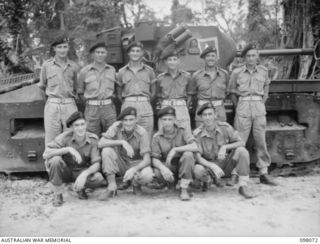 Group portrait of personnel of Fighting Headquarters Troop, A Squadron, 2/4th Armoured Regiment. Left to right, back row: NX43207 Trooper (Tpr) D C Meagher of Temora, NSW; NX161976 Tpr M G Bell of ..