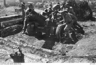 DOYABIE AREA, BOUGAINVILLE ISLAND. 1944-11-25. "SNIFTER", THE SHORT 25 POUNDER GUN WHICH WAS BROUGHT INTO DUMPU BY AIR LAST YEAR AND USED BY THE 4TH FIELD REGIMENT IN THE FINISTERRE RANGES, BEING ..