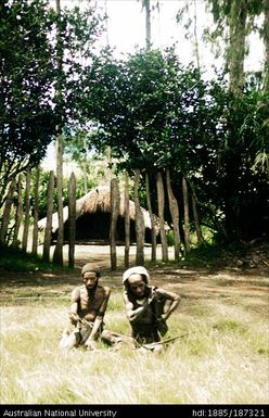 Two men sitting on the ground