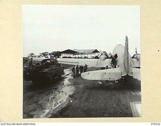 LAE, NEW GUINEA. 1943-11. PERSONNEL OF THE 10TH FIELD AMBULANCE USING DUKWS TO TRANSPORT WALKING PATIENTS FROM THE AMERICAN HOSPITAL SHIP, SS "NORAB" AND THE HOSPITAL SHIP, SS "STRADBROKE II" TO ..