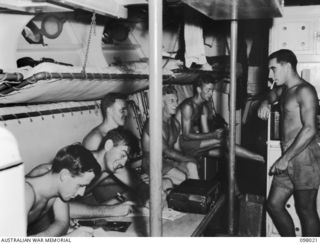 SIMPSON HARBOUR, NEW BRITAIN. 1945-10-13. THE MESS DECK OF THE MOTOR LAUNCH 825, ROYAL AUSTRALIAN NAVY. THE VESSEL IS THE ONLY MOTOR LAUNCH IN THE SOUTH WEST PACIFIC AREA TO BRING DOWN A JAPANESE ..