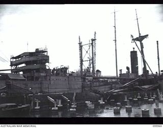 RABAUL, NEW BRITAIN, 1946-04-04. A JAPANESE CARGO SHIP AT NAVAL HQ, SALVAGED FROM THE HARBOUR BY THE ROYAL AUSTRALIAN NAVY