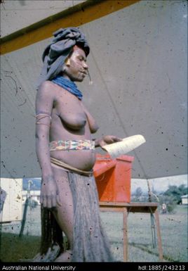 Woman holding ballot paper