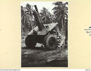 AITAPE, NEW GUINEA. 1945-03-10. ARTILLERY IN JUNGLE CONDITIONS. A NEW HIGH ANGLE 25-POUNDER POSITION INSTALLED IN THE 6 DIVISION AREA BY 2/3 FIELD REGIMENT, ROYAL AUSTRALIAN ARMY PERSONNEL