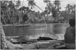 Tukwaukwa village on Kiriwina: seen from canoes in lagoon