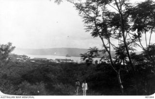 RABAUL, NEW BRITAIN. C. 1916. VIEW TAKEN FROM THE BOTANIC GARDENS SHOWING PART OF THE TOWN WITH THE HARBOUR IN THE BACKGROUND