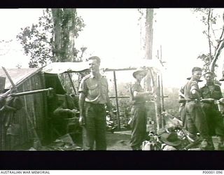 THE SOLOMON ISLANDS, 1945. AUSTRALIAN SOLDIERS AT THEIR CAMPSITE BESIDE THE NUMA NUMA TRAIL ON BOUGAINVILLE ISLAND. (RNZAF OFFICIAL PHOTOGRAPH.)