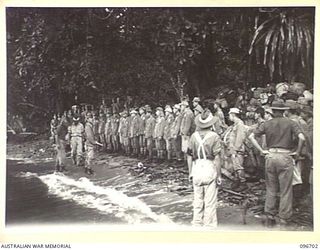 KAIRIRU ISLAND, NEW GUINEA. 1945-09-17. A PARADE OF 200 JAPANESE NAVAL PERSONNEL ON A SMALL BEACH IN VICTORIA BAY. THIS WAS THE FIRST TIME THEY HAD BEEN VISITED BY AUSTRALIANS. FOLLOWING THE ..