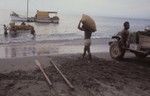 Loading cacao on boat