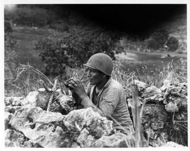 Pfc Carl Gorman of Chinle, Arizona, an Indian Marine who Manned an Observation Post on a Hill Overlooking the City of Garapan, while the Marines were Consolidating their Positions on the Island of Saipan, Marianas