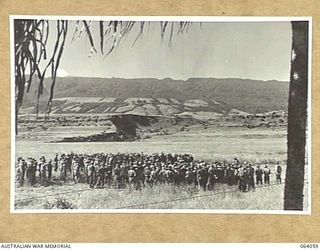 KELANOA, NEW GUINEA. 1944-01-22. A CHURCH PARADE BEING CONDUCTED BY NX139075 CHAPLAIN T.J. YATES, CHURCH OF ENGLAND IN THE 2/15TH INFANTRY BATTALION REST AREA