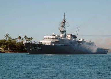 Japanese Sailors stationed aboard the Japan Maritime Self-Defense Force Training Ship JDS KASHIMA (TV 3508) render honors during a 21-gun salute as they enter Naval Station Pearl Harbor, Hawaii, on Aug. 18, 2006. More than 1,000 Japanese Sailors are visiting Pearl Harbor during a worldwide training and international relations cruise. (U.S. Navy photo by Mass Communication SPECIALIST 1ST Class James E. Foehl) (Released)