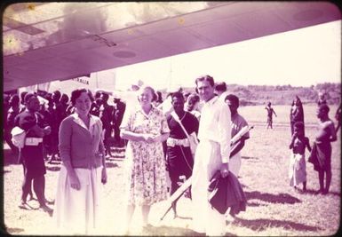 Mrs Kathleen Tomlinson, Mrs Alma Emmanuel, Judge Frank McGrath on airstrip : Minj Station, Wahgi Valley, Papua New Guinea, 1954 / Terence and Margaret Spencer