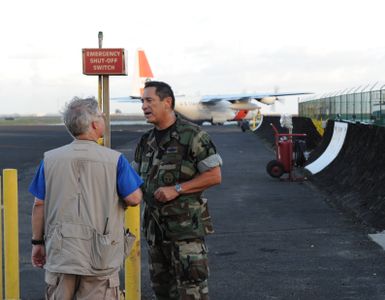 Earthquake ^ Tsunami - Pago Pago, American Samoa, October 5, 2009 -- Captain Michael Bryce, U. S. Public Health Service and Toby Clairmont, Team Commander, Hawaii Disaster Medical Assistance Team (DMAT), breath a sigh of relief as a Coast Guard plane carrying an infant is evacuated to Hawaii. The Hawaii DMAT assisted with the emergency evacuation of the infant. DMATs are part of the U. S. Department of Health and Human Services' National Disaster Medical System which supports hospitals and other medical and public health needs of communities during disasters such as the earthquake and tsunami disaster in American Samoa. FEMA/Casey Deshong