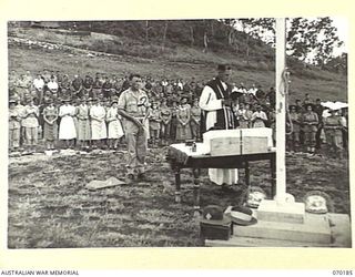 PORT MORESBY, NEW GUINEA. 1944-02-07. WX17091 CHAPLAIN C.W. CUNNINGHAM, MBE., (ROMAN CATHOLIC) (1) CELEBRATING THE REQUIEM MASS AT BOMANA WAR CEMETERY WITH NX45303 PRIVATE J.A. SMITH (2) IN ..