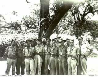 NEW BRITAIN, 1945-10. A GROUP OF AUSTRALIAN AND NEW ZEALAND SERVICE OFFICERS AT RABAUL. (RNZAF OFFICIAL PHOTOGRAPH.)