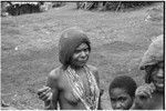 Fainjur: woman wearing netted cap and strings of trade beads