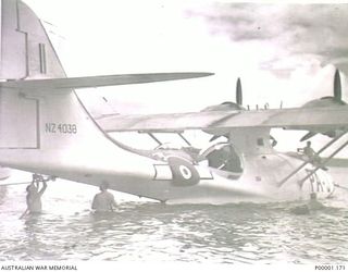 THE SOLOMON ISLANDS, 1945. A RNZAF CATALINA AIRCRAFT ANCHORED IN SHALLOW WATER AT BOUGAINVILLE ISLAND. (RNZAF OFFICIAL PHOTOGRAPH.)