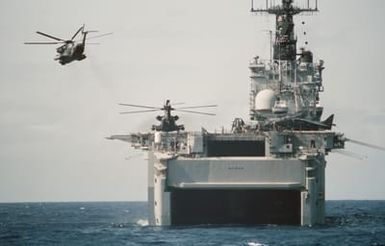 A CH-53D Sea Stallion helicopter attached to Marine Medium Helicopter Squadron 261 (HMM-261) departs the amphibious assault ship USS SAIPAN (LHA 2) during Operation Sharp Edge. Marines of the 22nd Marine Expeditionary Unit (22nd MEU) are being sent to the U.S. Embassy in Monrovia, Liberia, to augment security and evacuate U.S. and foreign nationals from the fighting between government and rebel forces