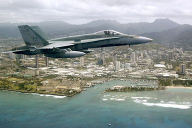 A Royal Canadian Navy CF-18C Hornet aircraft in flight off the coast near Pearl Harbor, Hawaii (HI) in celebration of Canada Day for the Rim of the Pacific (RIMPAC) 2006 Exercise, the world's largest biennial maritime exercise