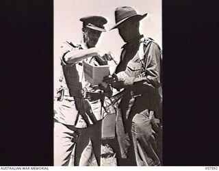 KAIAPIT, NEW GUINEA. 1943-09-24. VX9 MAJOR GENERAL G. A. VASEY CB OBE DSO, GENERAL OFFICER COMMANDING, 7TH AUSTRALIAN DIVISION, ARRIVES AT THE AIRSTRIP WITH NX148 BRIGADIER I. N. DOUGHERTY DSO, ..