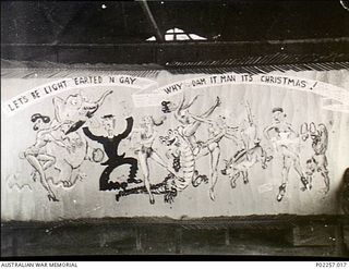 Madang, New Guinea, 1945-12. A large mural which forms part of the Christmas decorations in the Officers' Mess at Headquarters, RAAF Northern Command (NORCOM). The mural, painted on paper by artist ..