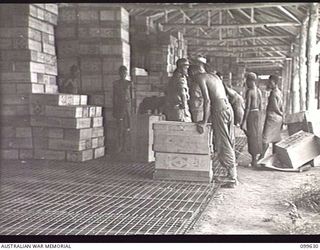 LAE, NEW GUINEA, 1946-01-11. THE INTERIOR OF ONE OF THE HUTS USED FOR THE STORAGE OF DRY GOODS AT AUSTRALIAN ARMY CANTEENS SERVICE BULK STORES