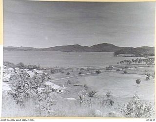 PORT MORESBY - ARMY HUTS NEAREST BAY, OIL CO. HUTS LEFT CENTRE, AIR FORCE HUTS NEAREST CAMERA, AT KONEDOBU CAMP. GOLF COURSE ON FLAT. RAAF SURVEY FLIGHT. (NEGATIVE BY N. TRACY)