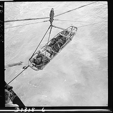 Japanese prisoner being transferred to the USS Hornet (CV-12) after Navy planes had shot down the plane that was evacuating him from Saipan.