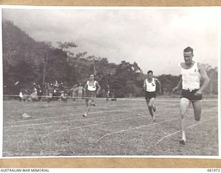 17 MILE, PORT MORESBY AREA, NEW GUINEA. 1943-12-25. FINISH OF THE 100 YARDS CHAMPIONSHIPS AT THE 10TH AUSTRALIAN ADVANCED ORDNANCE DEPOT SPORTS MEETING. RESULTS WERE: 1ST AUSTRALIAN ADVANCED ..
