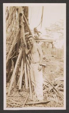 [Shirtless Serviceman Beside Tree]