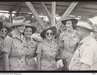 TOROKINA, BOUGAINVILLE. 1945-10-29. GENERAL SIR THOMAS A. BLAMEY, COMMANDER IN CHIEF, AUSTRALIAN MILITARY FORCES, CHATTING WITH NURSING SISTERS FROM 2/1ST GENERAL HOSPITAL AT THE CONCLUSION OF THE ..