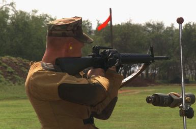 A US Marine Corp (USMC) Marine of 1ST Battalion, 3rd Marine Regiment prepares to fire his 5.56 mm M16A2 rifle in the 2003 Pacific Division Matches at Puuloa Range, Marine Corps Base Hawaii (MCBH), Hawaii (HI)