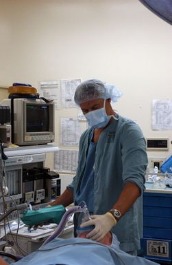 US Air Force (USAF) Lieutenant Colonel (LCOL) James Schlimmer, an Anesthesiologist with the 133rd Minnesota (MN) Air National Guard (ANG) Medical Squadron (MS), puts a young US Marine Corps (USMC) female under before performing surgery at Tripler Army Medical Center, Hawaii (HI)