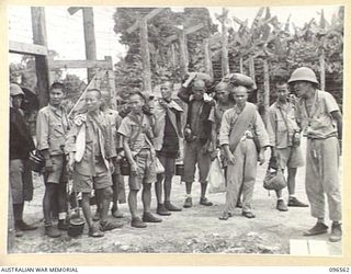 TOROKINA, BOUGAINVILLE. 1945-09-14. SOME OF THE MEMBERS OF A PARTY OF 79 CHINESE AT TOROKINA COMPOUND. FORMER PRISONERS OF THE JAPANESE THEY WERE RELEASED WHEN AUSTRALIAN TROOPS OCCUPIED THE ..