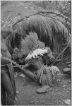 Pig festival, wig ritual: man bespells drums to be loud and pleasing to ancestors