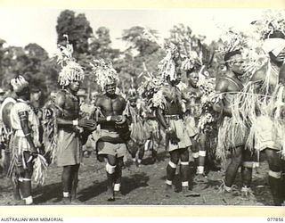 MALAHANG, LAE, NEW GUINEA. 1944-12-25. NATIVES PARTICIPATING IN THE SING-SING HELD IN THE AUSTRALIAN NEW GUINEA ADMINISTRATIVE UNIT NATIVE COMPOUND